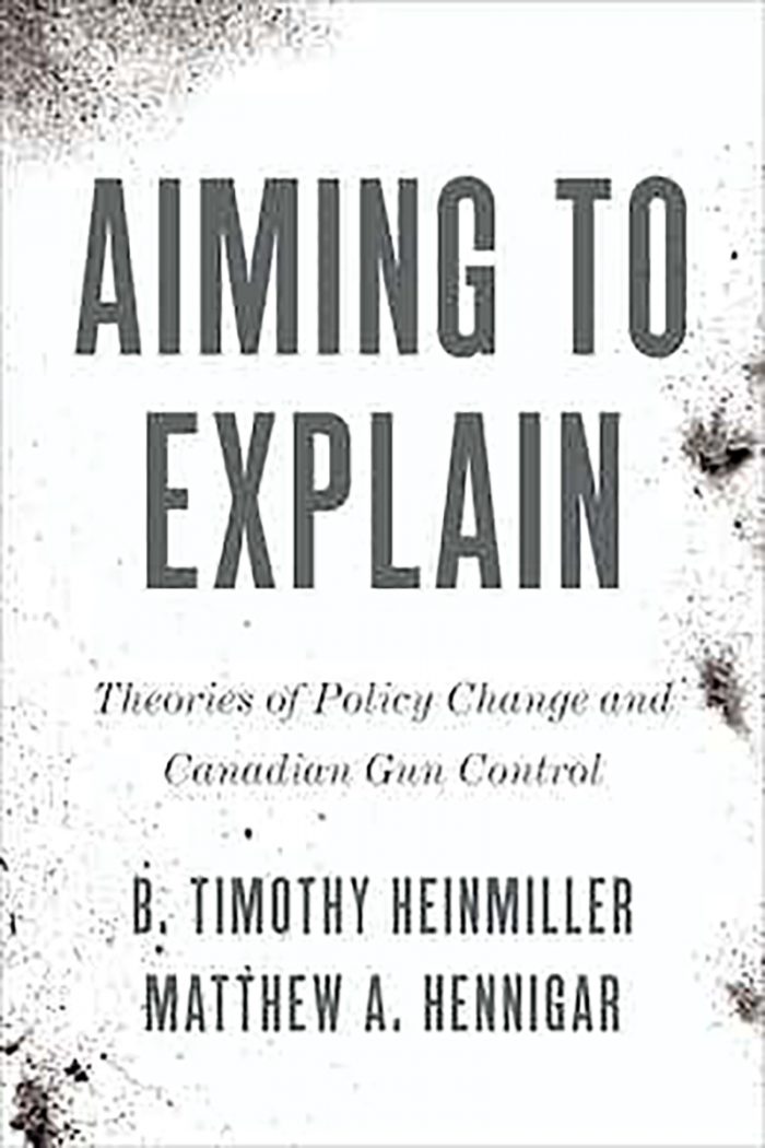 A book cover for Aiming to Explain: Theories of Policy Change and Canadian Gun Control. 