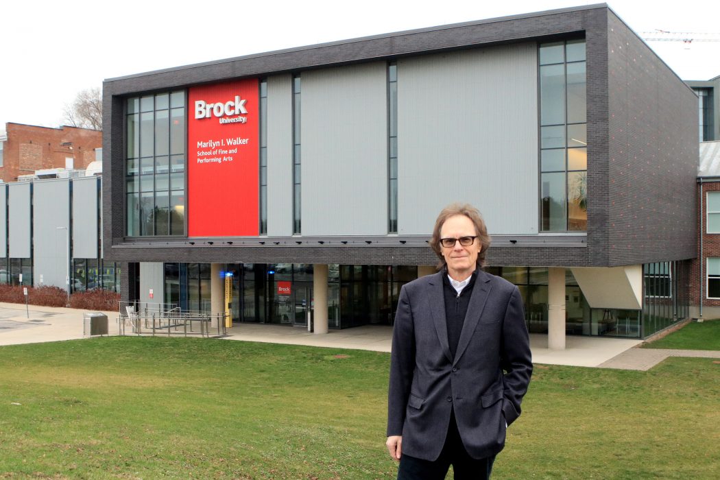 Derek Knight stands in front of Brock University's Marilyn I. Walker School of Fine and Performing Arts in downtown St. Catharines.