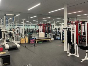Bfit exercise machines are arranged in an open concept space.