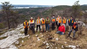 A group of Brock University students standing on top of the Lorraine Formation, a 2-billion-year-old quartzite.
