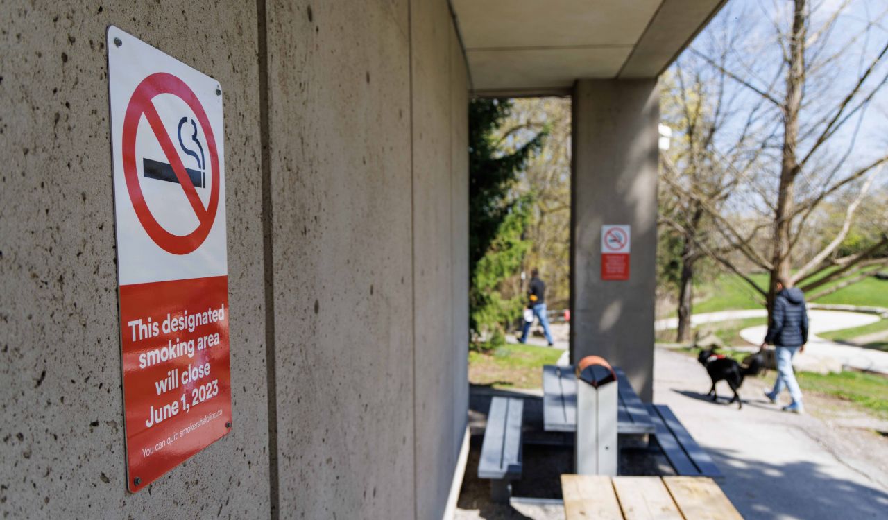 A no smoking sign with the text, “This designated smoking area will close June 1, 2023, is posted on a building.