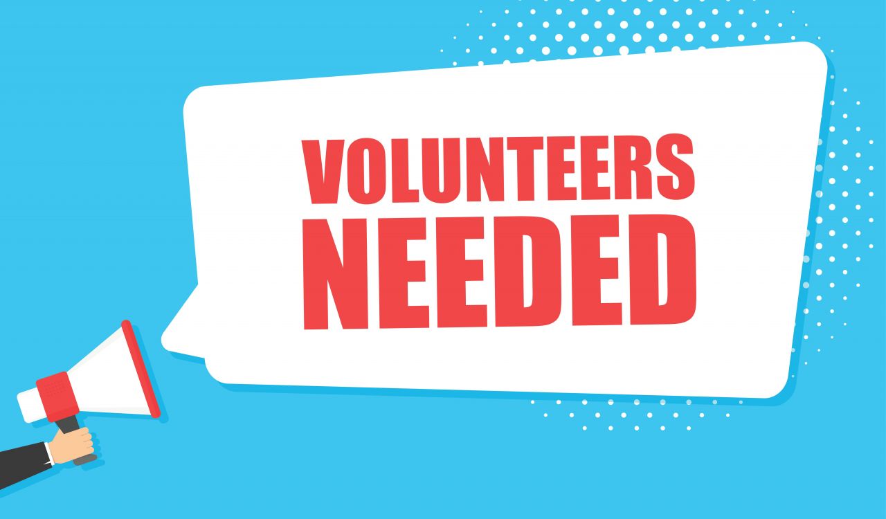 A graphic with a picture of a megaphone and the words ‘volunteers needed.’