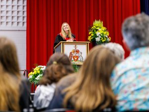 A speaker stands behind a podium at Brock University's Convocation ceremony.
