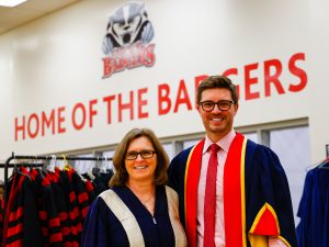 Brock President and Vice-Chancellor Lesley Rigg stands beside Kyle Dubas before Brock's Convocation ceremony.