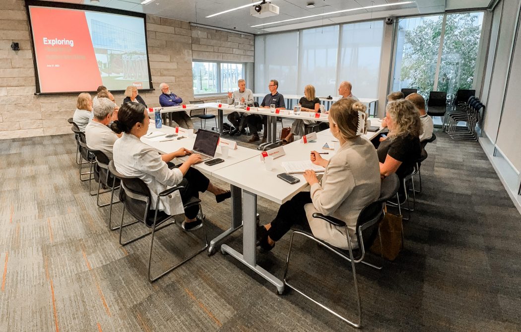 A group of people participate in a roundtable discussion.