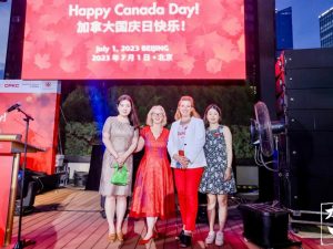 Four women pose for a Canada Day celebration in Beijing, China.