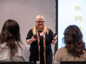 An instructor for Brock University Professional and Continuing Studies speaks to learners about onboarding new hires in a human resources learning session.