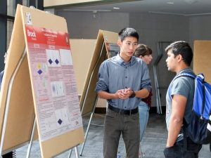 Brock University Physics student Eric He presents a poster of research on “Bound States without Potentials: Localization at Singularities.”