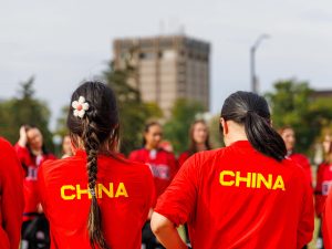 Members of the Chinese women’s national hockey team line up during a tree planting ceremony on Brock University’s main campus.