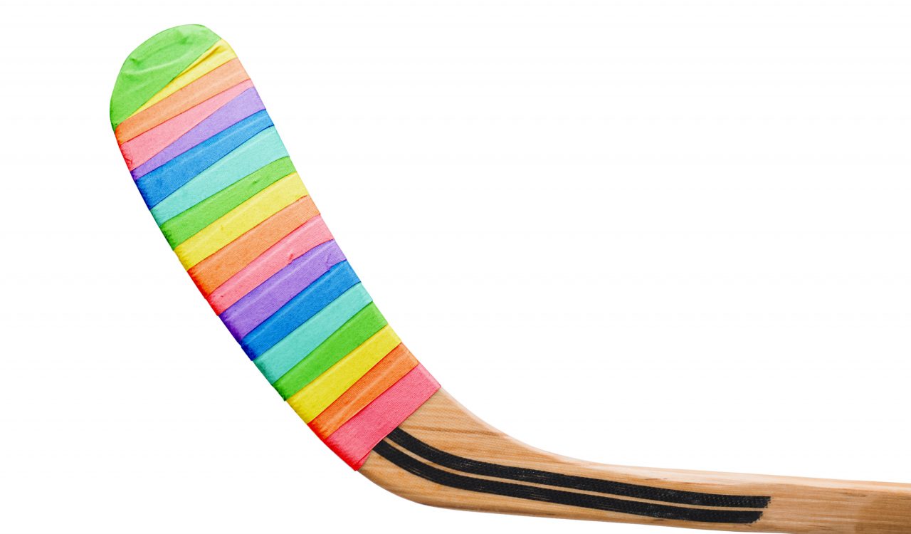 Hockey stick wrapped in rainbow tape.