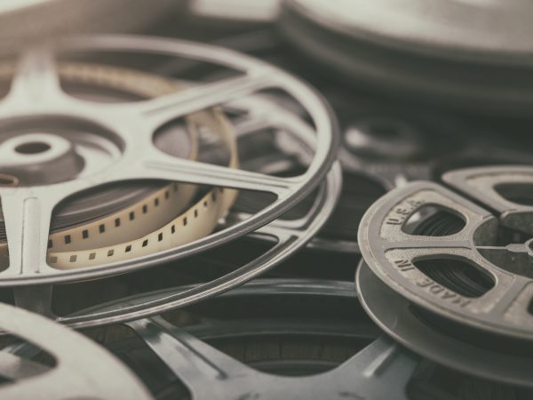 Film reels stacked on a table.