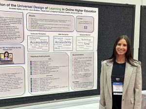 Amanda Bailey stands beside a research poster.