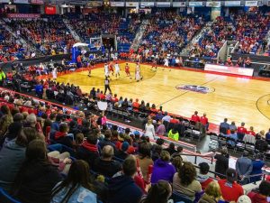 An arena full of fans watch a basketball game in St. Catharines.