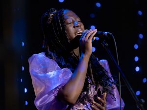 Brock University student Amanda Ogunmekan sings on stage at the 2023 Brock’s Got Talent finale.