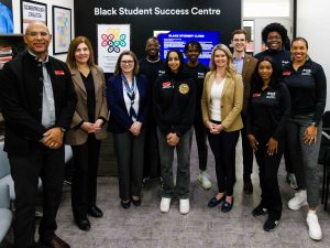 A group of people pose for a photo in Brock's Black Student Success Centre.