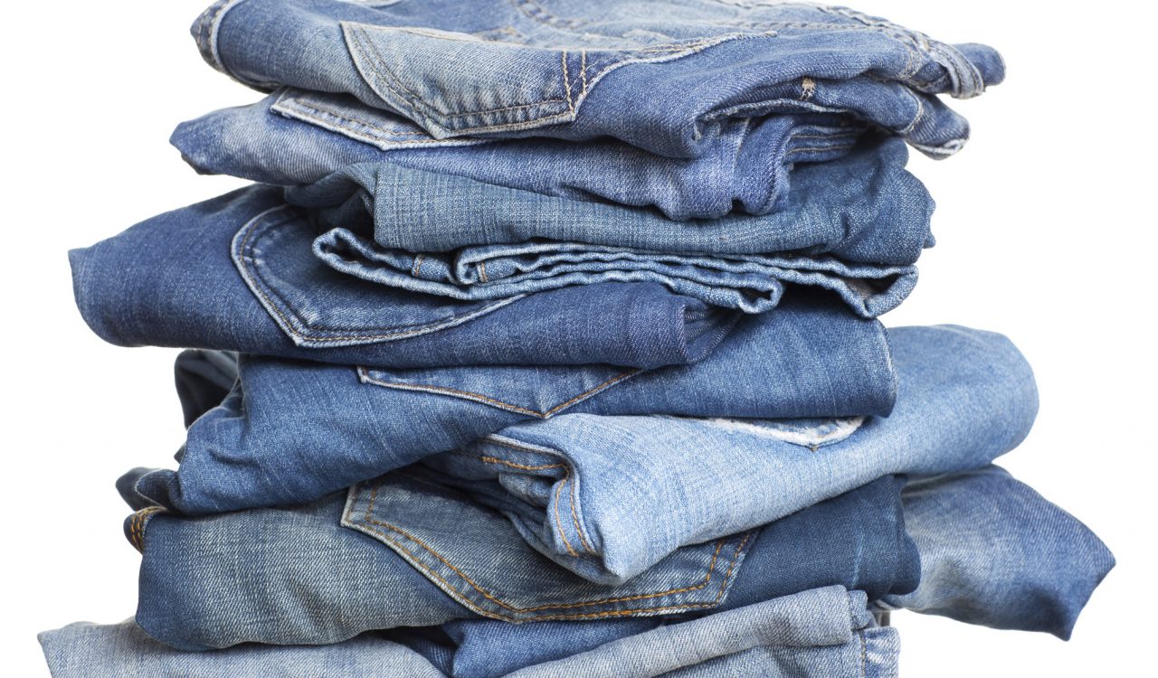 A stack of denim blue jeans.