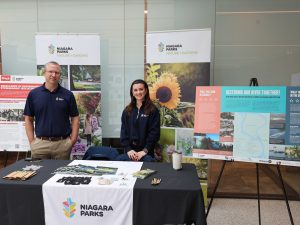 Corey Burant and Victoria Kaleniuk pose at the Niagara Parks booth at the first annual World Water Day Celebration.