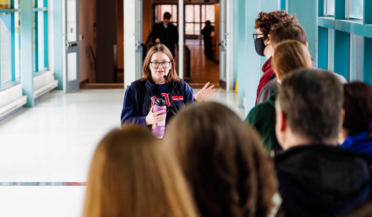 A woman guides a group of prospective students through Brock University’s main campus.