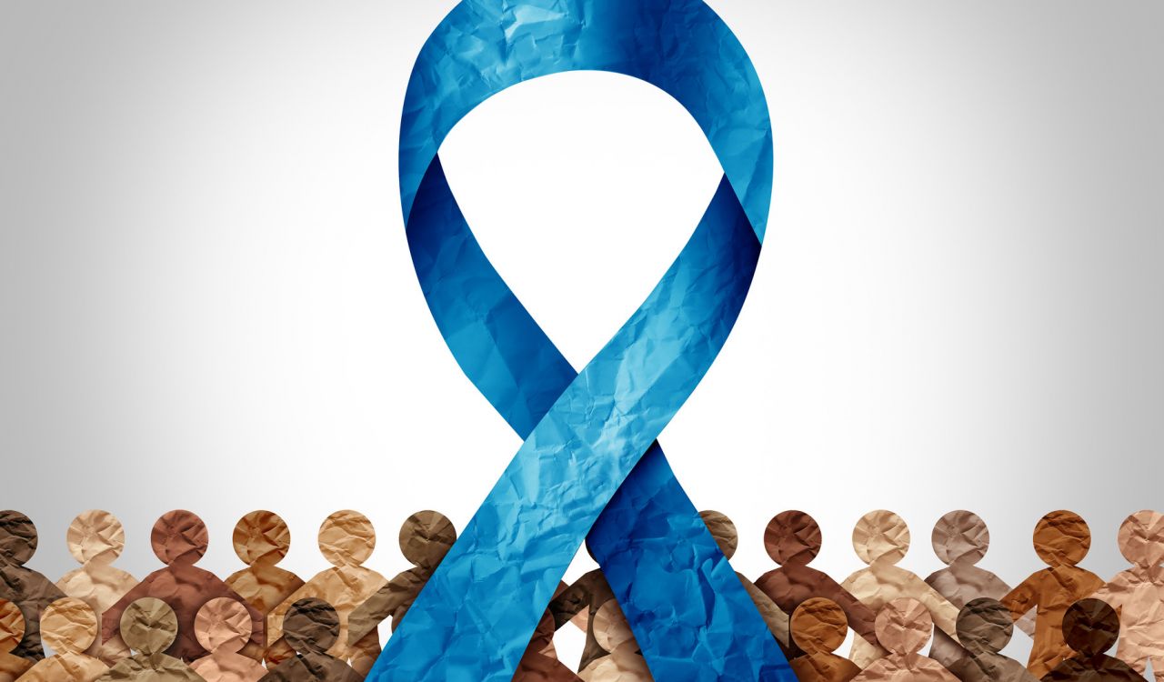 An illustrated blue ribbon above paper figurines of people.