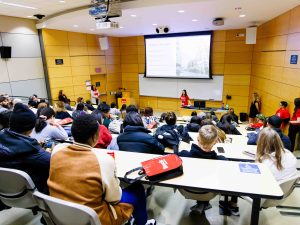 A crowd listens to a speaker inside of a lecture hall at Brock University.