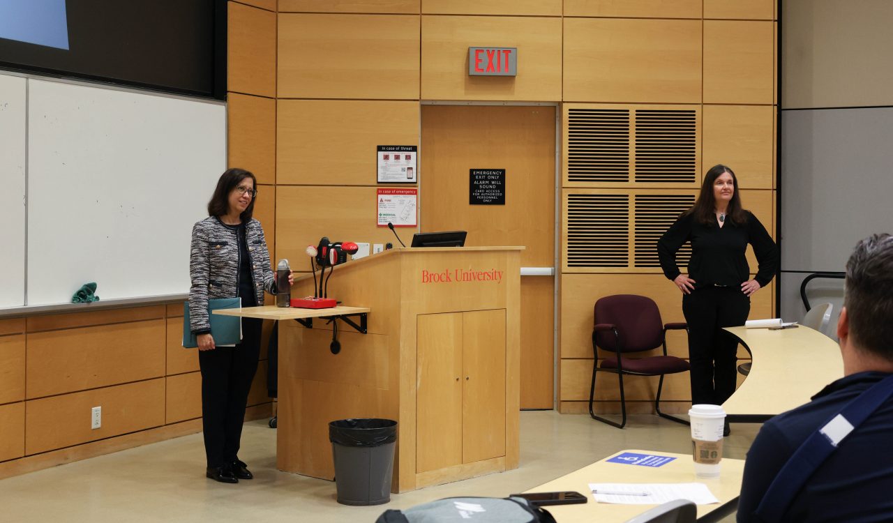 Chandra Hardeen and Kate Cassidy in a South Block lecture hall.
