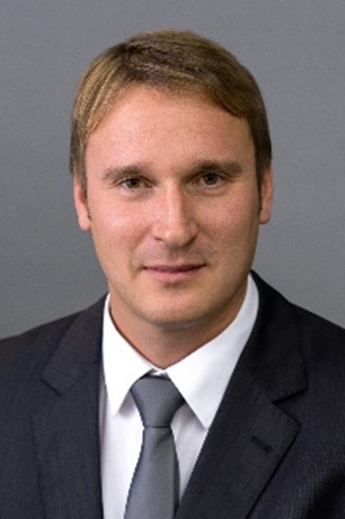 Headshot of a man in a suit. 