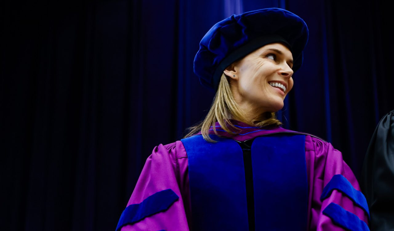 Brock University Associate Professor of Sport Management Shannon Kerwin wearing ceremonial academic regalia.