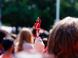 A hand holds up a small statue of Maj.-Gen. Sir Isaac Brock.