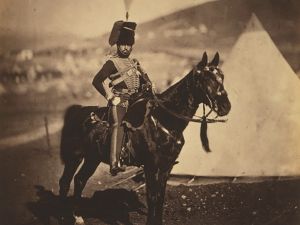 A historic image of a soldier on a horse.