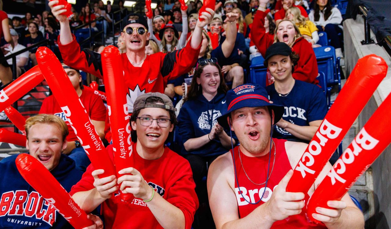 A crowd of people in an arena wearing Brock University gear.