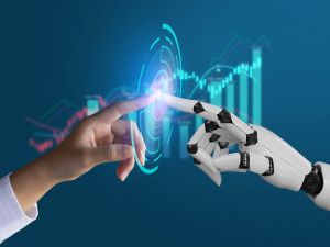 A human hand reaches to touch the hand of a robot, their index fingers nearly touching. In between their fingers is a digital illustration of a spiral made up of many rectangles in an irregular pattern. In the background is an out-of-focus line graph and bar chart.