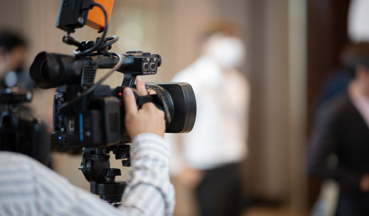 A video camera with a blurred background.