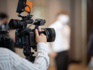 A video camera with a blurred background.