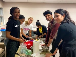 University students cook a meal together.