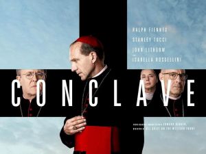 Movie poster for Conclave shows Ralph Fiennes and other actors forming a black cross against a background of the sky over the Vatican.