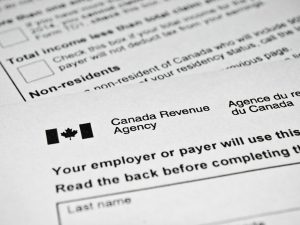 Close-up shot of Canada Revenue Agency tax forms.