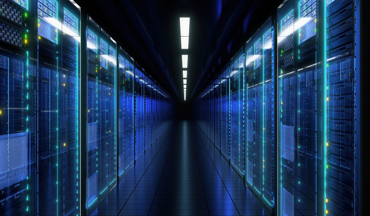 A server room lit by glowing blue lights.