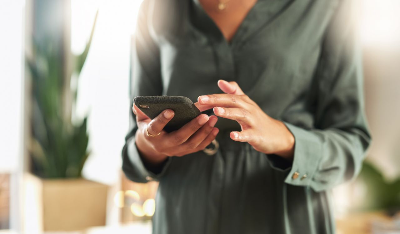 Close-up view of a cellphone being held by a woman.