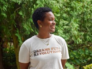 Tanika Hillocks, wearing a shirt that reads “Dreams fuel revolutions”.