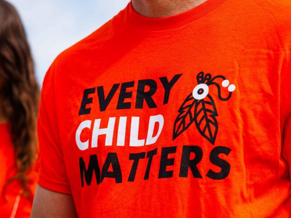 Close-up of a man wearing an orange 