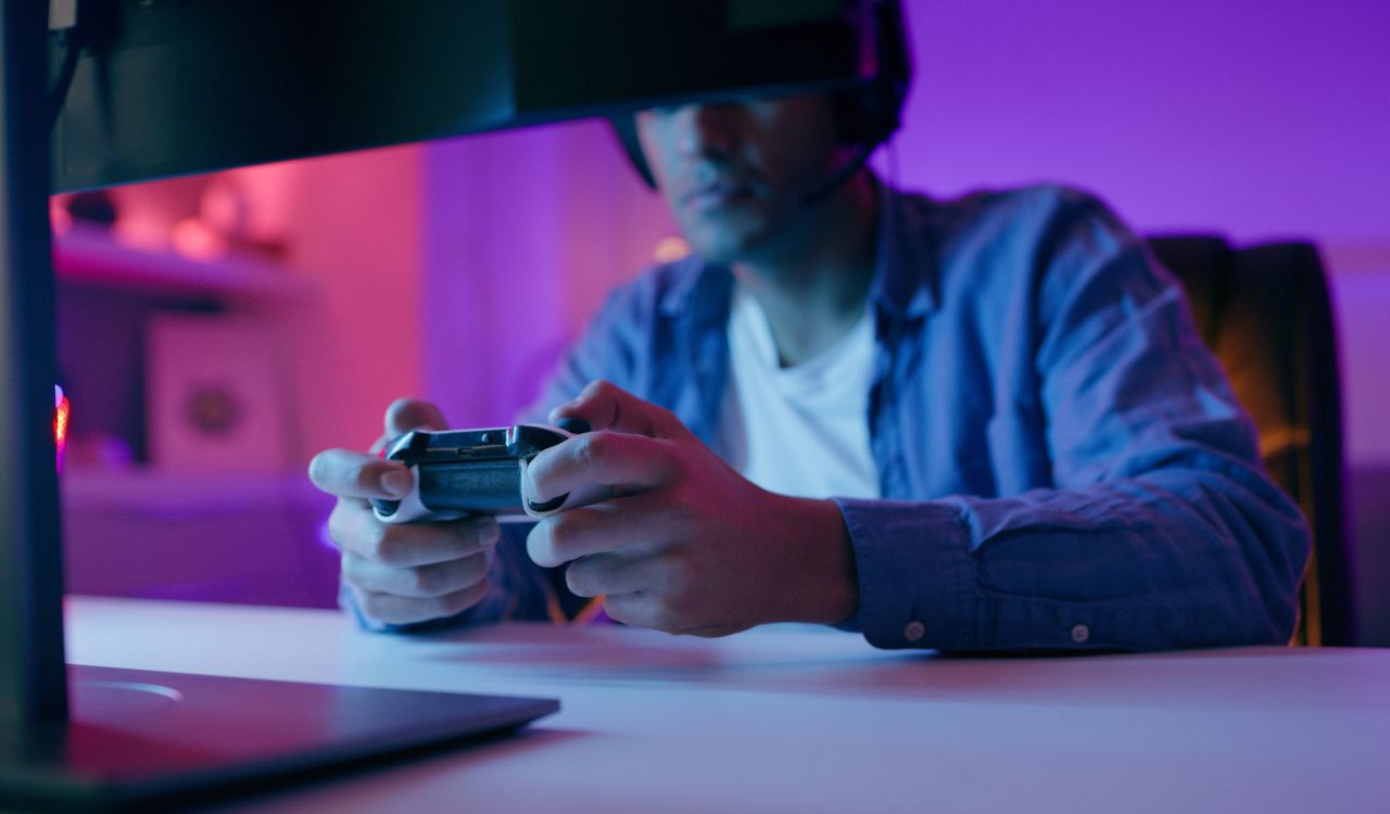 Close-up view of hands holding a video-game controller.
