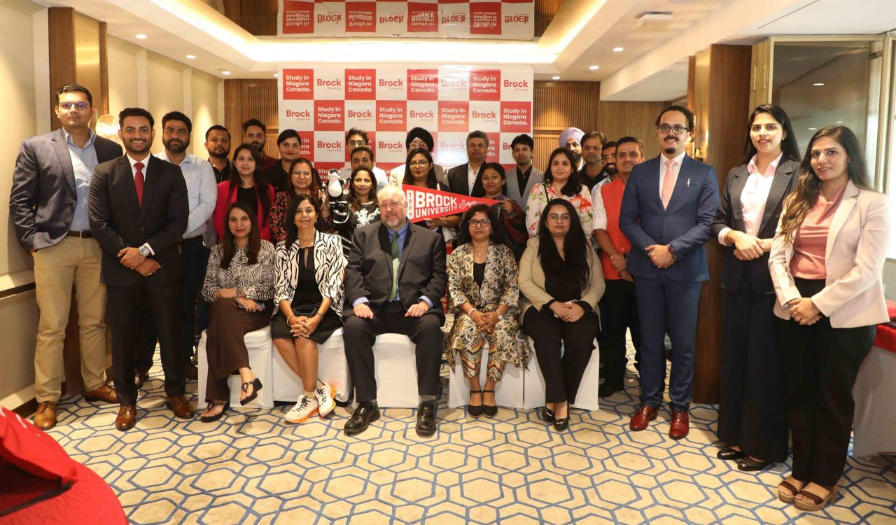 A large group of people poses for a photo.