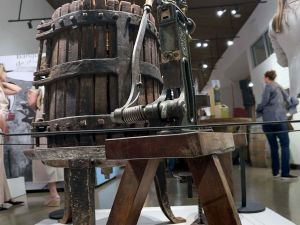 Vintage winemaking equipment in a museum.