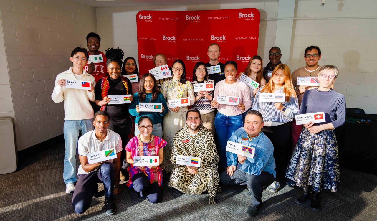 A large group of people pose for a photo.