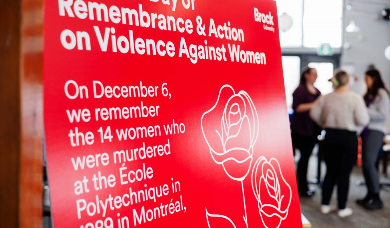 Sign that reads National Day of Remembrance and Action on Violence Against Women.