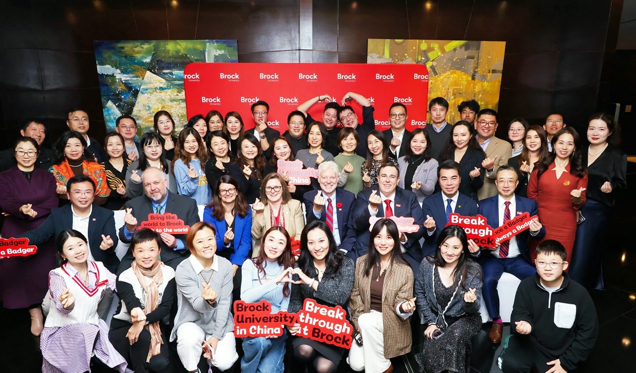 A large group of people gather together.