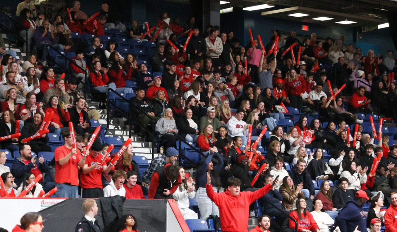 A crowd watches a basketball game.