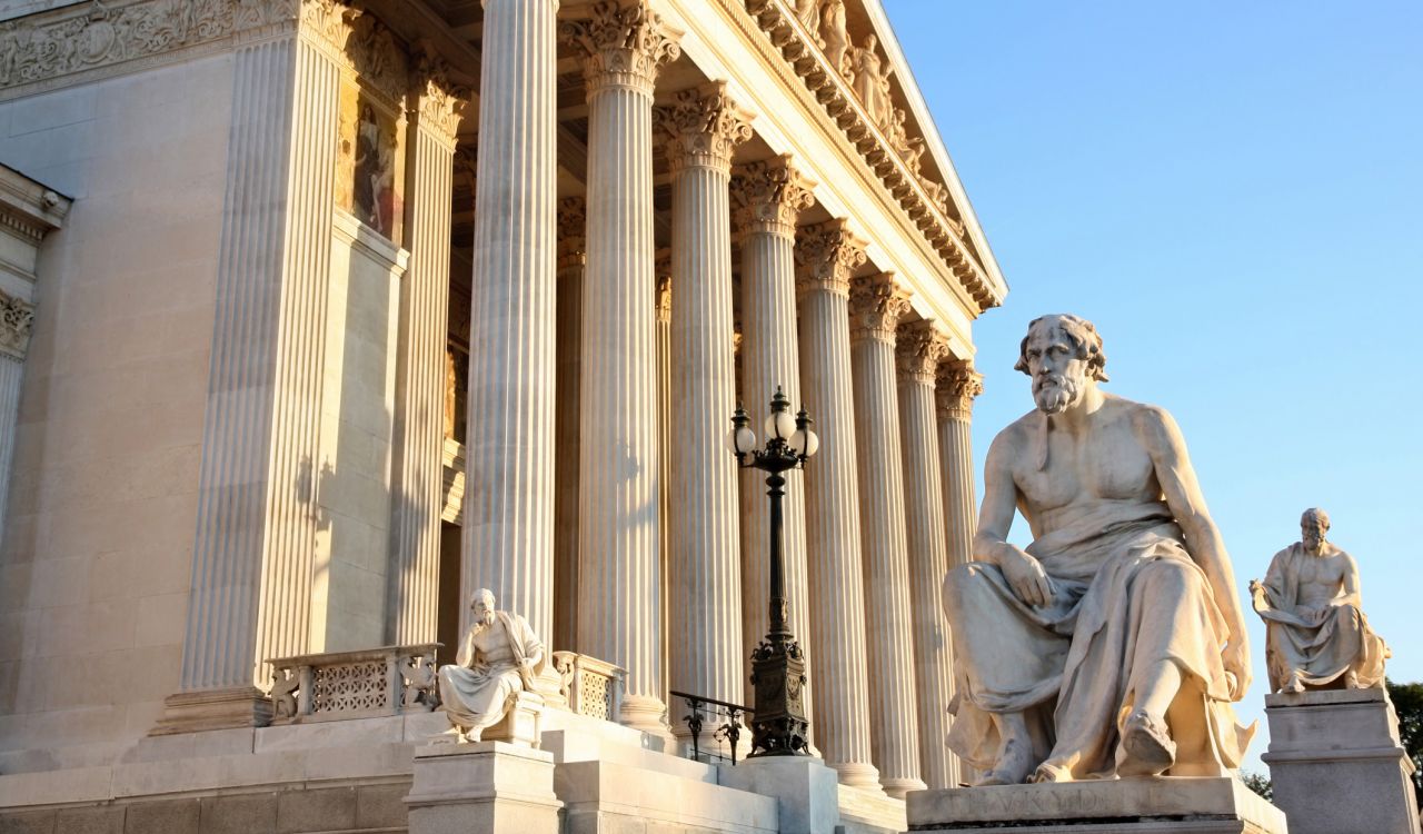 The Austrian Parliament with statue philosopher Thucydides in Vienna, Austria.