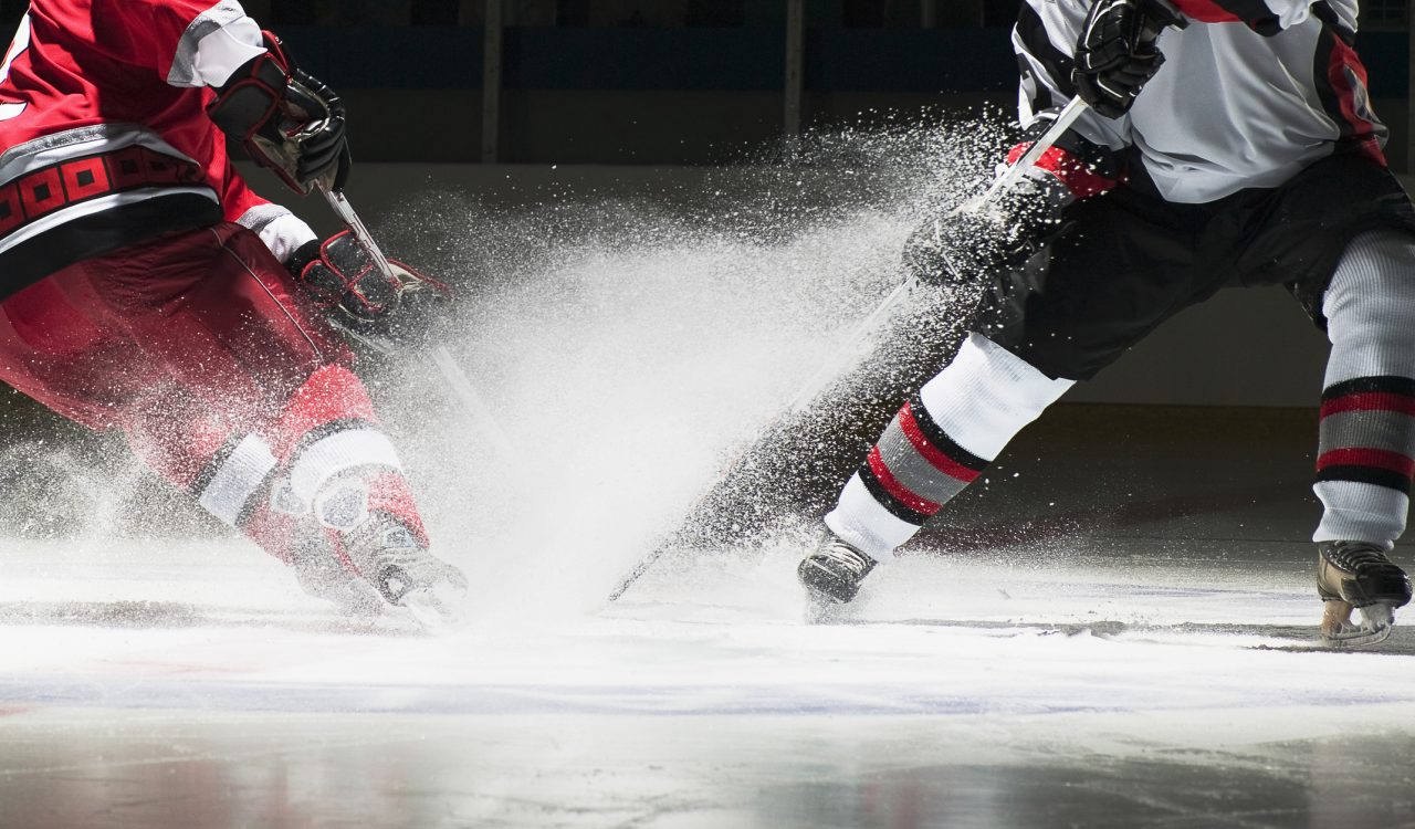 Close-up of two ice hockey players.