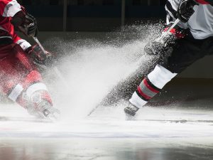 Close-up of two ice hockey players.